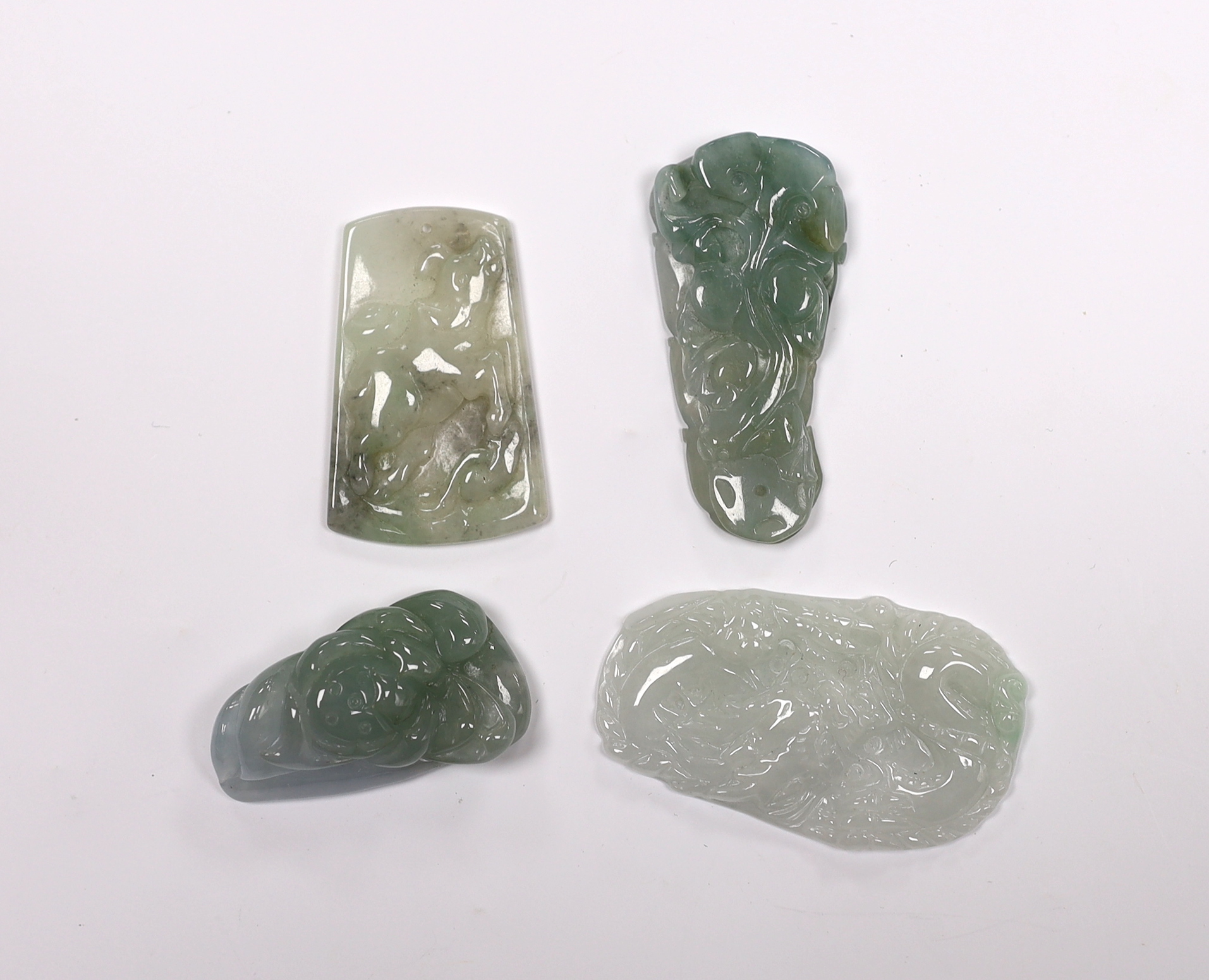 Four Chinese carved jadeite pendants